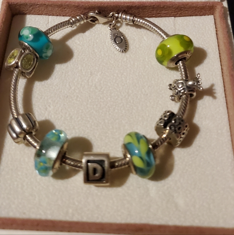 Pandora silver bracelet already to wear with charms on it. - Picture 3 of 3